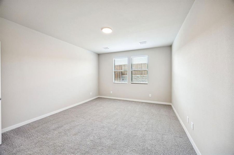 Primary Suite in the Willow home plan by Trophy Signature Homes – REPRESENTATIVE PHOTO