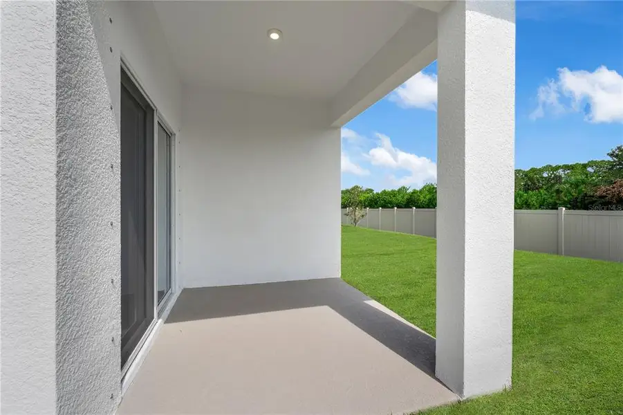 Exterior details and patio area of a home in Wynnstone, Davenport (Image 2).