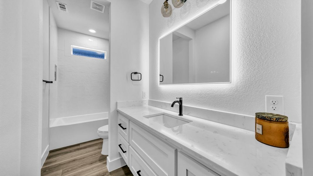 Representative furnished interior of a home built from the Zephyer 2 by Zeal Home Builders in Parallel Pastures, Poolville (Image 13).