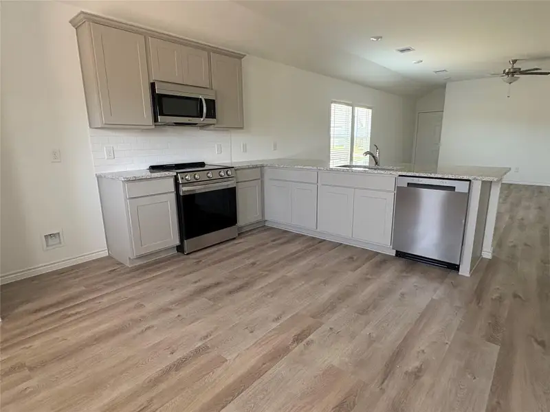 Furnished interior view inside a new home in , Conroe (Image 3).