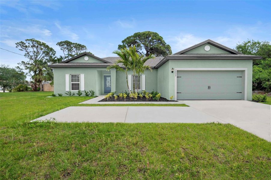 Front exterior of a new home in , Port St. Lucie, FL, highlighting curb appeal (Image 13). Front exterior of a new home in , Port St. Lucie, FL, highlighting curb appeal (Image 13).