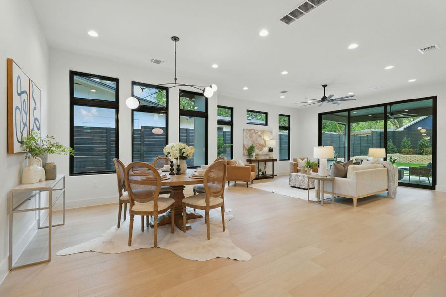 Dining area featuring recessed lighting, light wood-style floors, and a ceiling fan