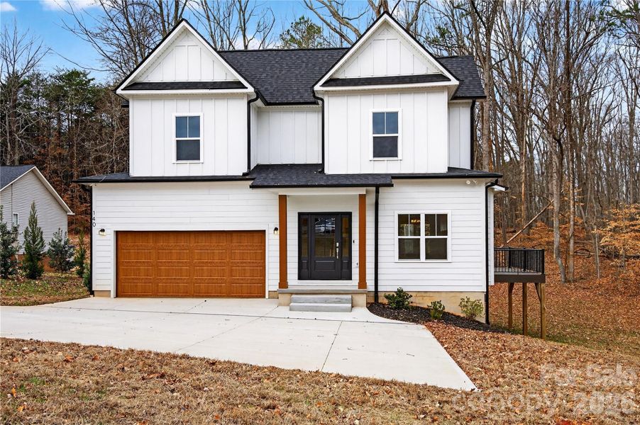 Front exterior of a new home in , Troutman, NC, highlighting curb appeal (Image 18).