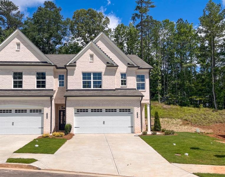 Front exterior of a new home in Riversong, Duluth, GA, highlighting curb appeal (Image 22).
