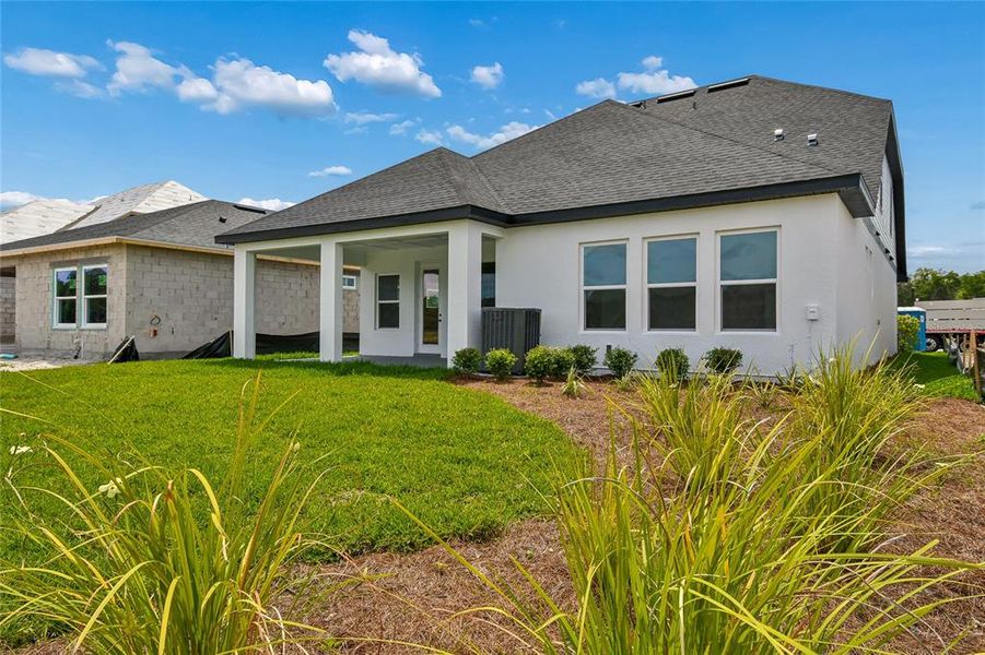 Exterior details and patio area of a home in Oakfield at Mount Dora Village Series, Mount Dora (Image 18).