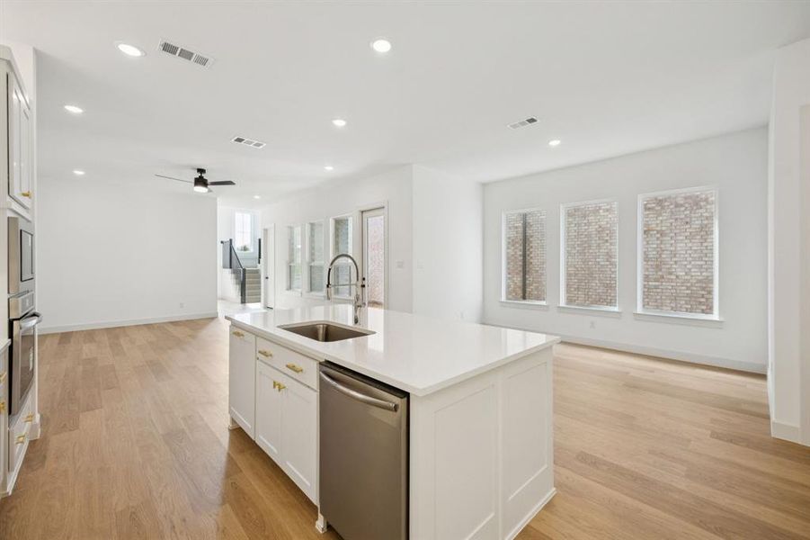 With the kitchen open to the dining and family rooms, the chef in the family will never be left out of the party! With the kitchen open to the dining and family rooms, the chef in the family will never be left out of the party!