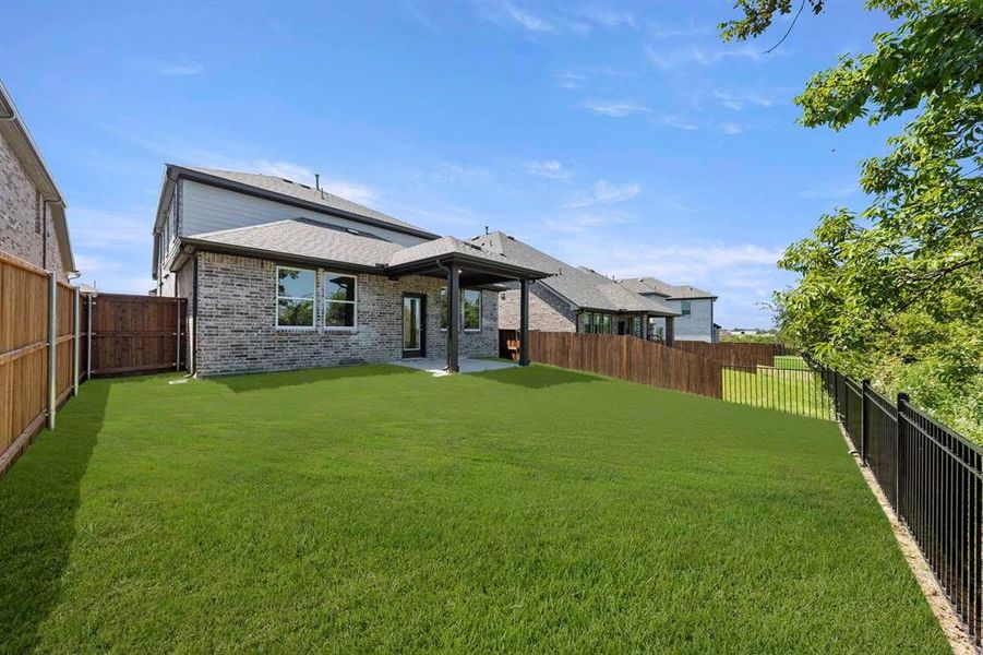 Exterior details and patio area of a home in Devonshire 40s, Forney (Image 3).