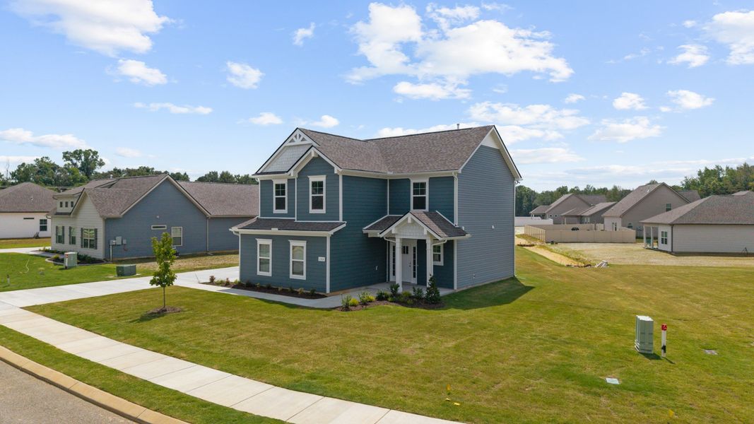 Front exterior of a new home in Stillwater, Tullahoma, TN, highlighting curb appeal (Image 21). Front exterior of a new home in Stillwater, Tullahoma, TN, highlighting curb appeal (Image 21).