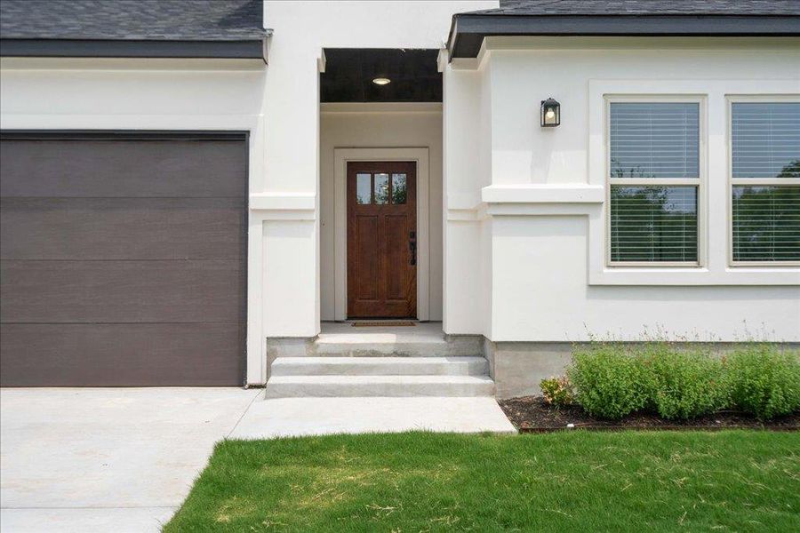 Exterior steps lead to a secluded front porch and entryway. Exterior steps lead to a secluded front porch and entryway.