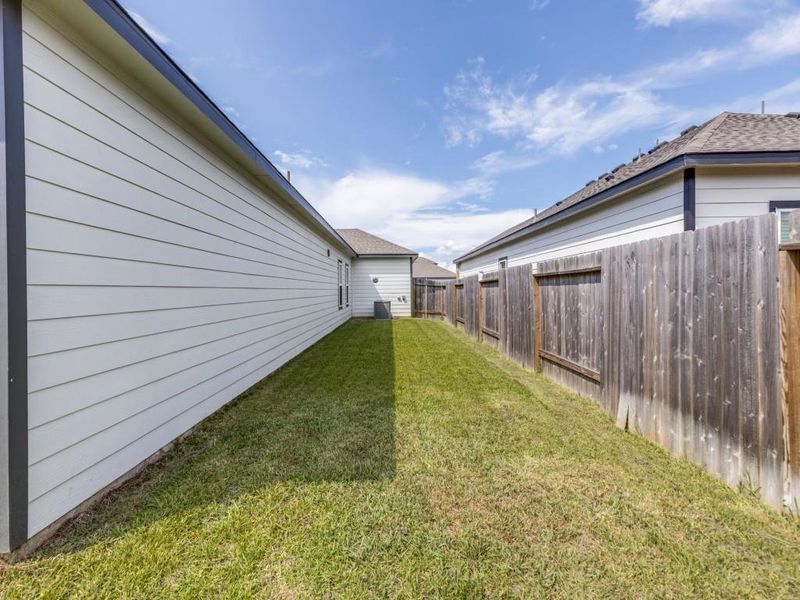 Exterior details and patio area of a home in , Conroe (Image 23).