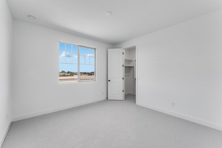 Representative unfurnished interior of a home built from the Denali by Taylor Morrison in Ellsworth Ranch Voyage Collection, Queen Creek (Image 40).