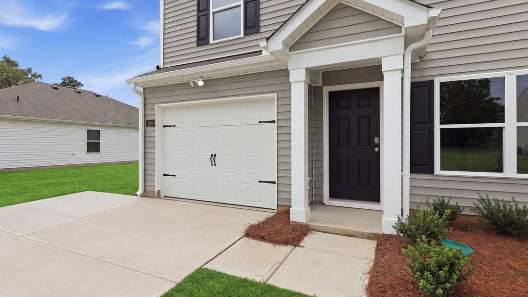 Exterior details and patio area of a home in Hobbs Farm, Ayden (Image 3).