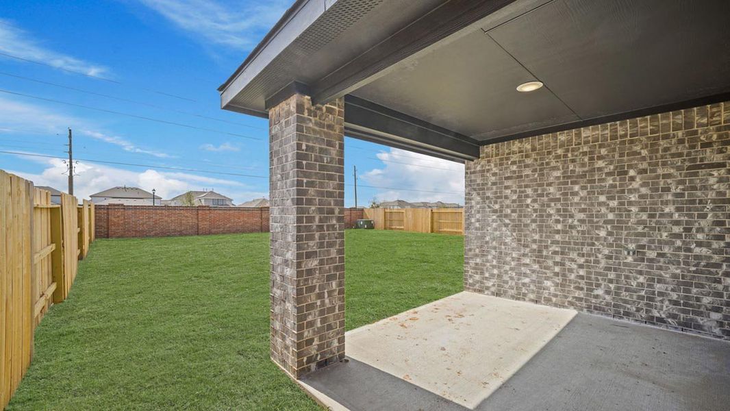 Exterior details and patio area of a home in Sunterra, Katy (Image 3).