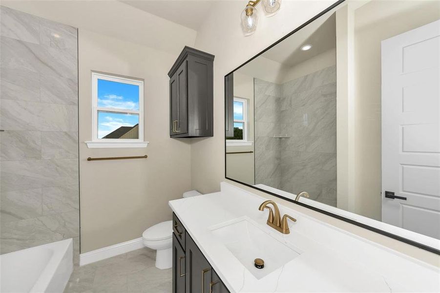 Full bathroom with baseboards and vanity