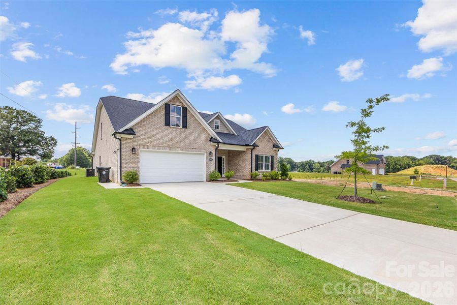 Front exterior of a new home in , Waxhaw, NC, highlighting curb appeal (Image 26). Front exterior of a new home in , Waxhaw, NC, highlighting curb appeal (Image 26).