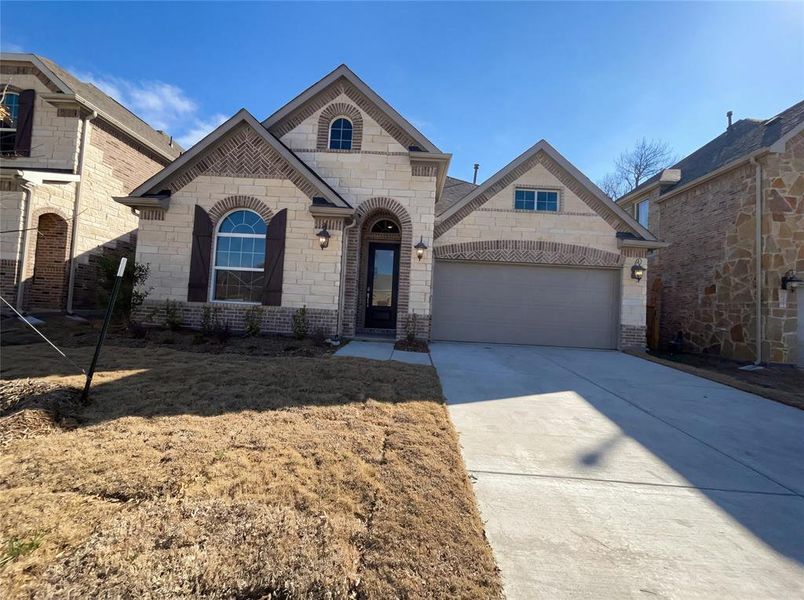 Front exterior of a new home in Shaded Tree, McKinney, TX, highlighting curb appeal (Image 16).