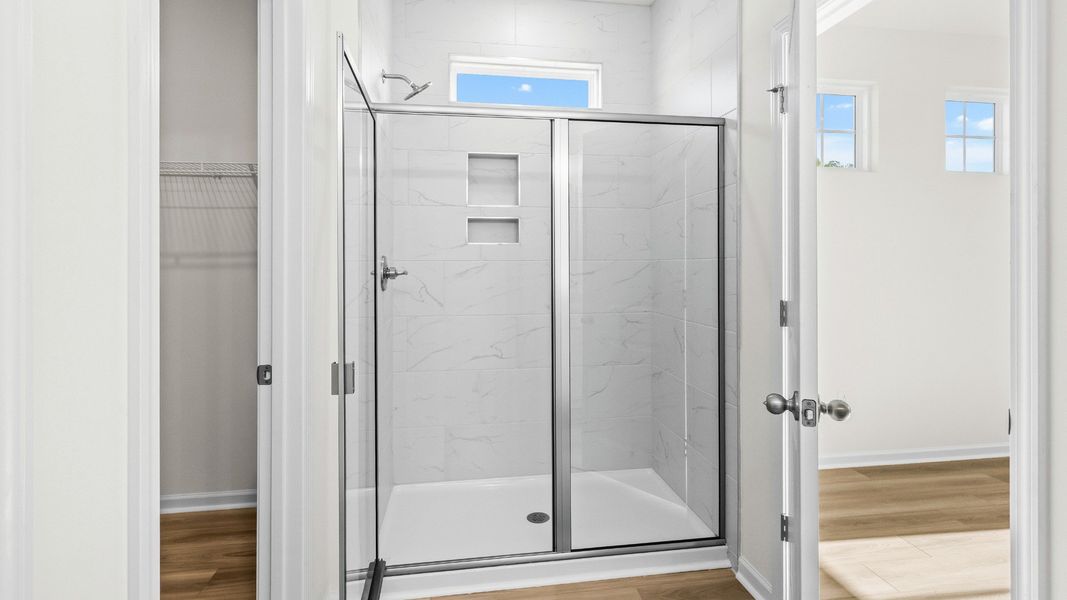 A sleek tiled shower adds modern style to the Easton’s primary suite A sleek tiled shower adds modern style to the Easton’s primary suite
