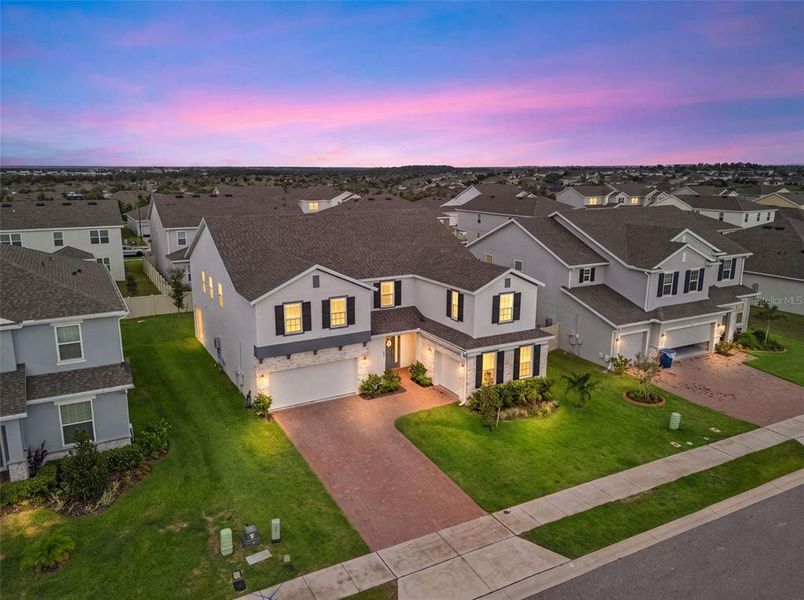 Front exterior of a new home in , Minneola, FL, highlighting curb appeal (Image 31). Front exterior of a new home in , Minneola, FL, highlighting curb appeal (Image 31).