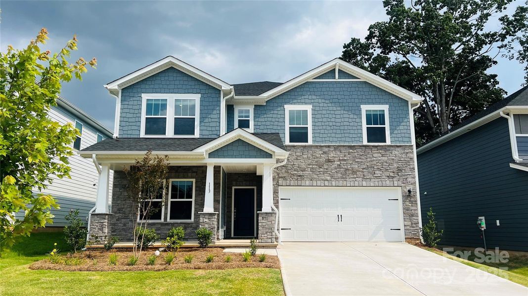 Front exterior of a new home in Sutter's Mill, Mooresville, NC, highlighting curb appeal (Image 1).