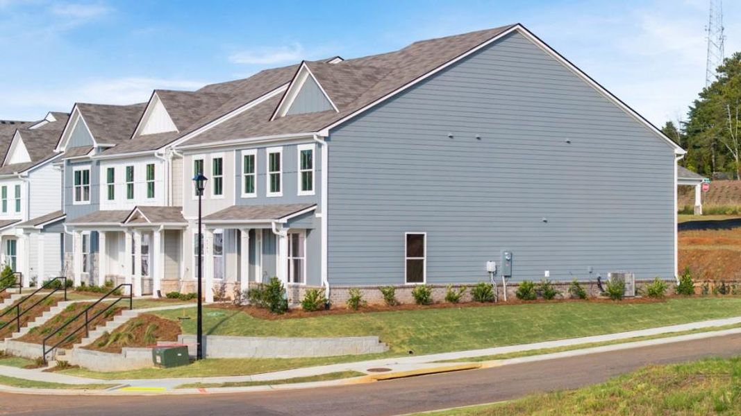 Front exterior of a new home in Waypoint, Flowery Branch, GA, highlighting curb appeal (Image 1).