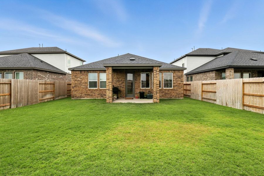 Front exterior of a new home in Bridge Creek 45s and 50s, Cypress, TX, highlighting curb appeal (Image 21). Front exterior of a new home in Bridge Creek 45s and 50s, Cypress, TX, highlighting curb appeal (Image 21).