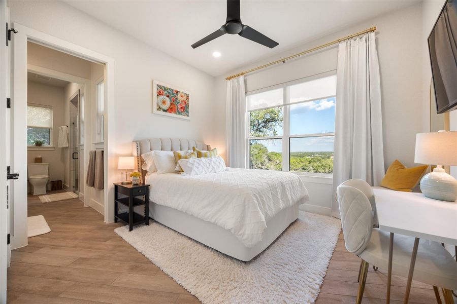 Bedroom with light hardwood / wood-style flooring and ceiling fan Bedroom with light hardwood / wood-style flooring and ceiling fan