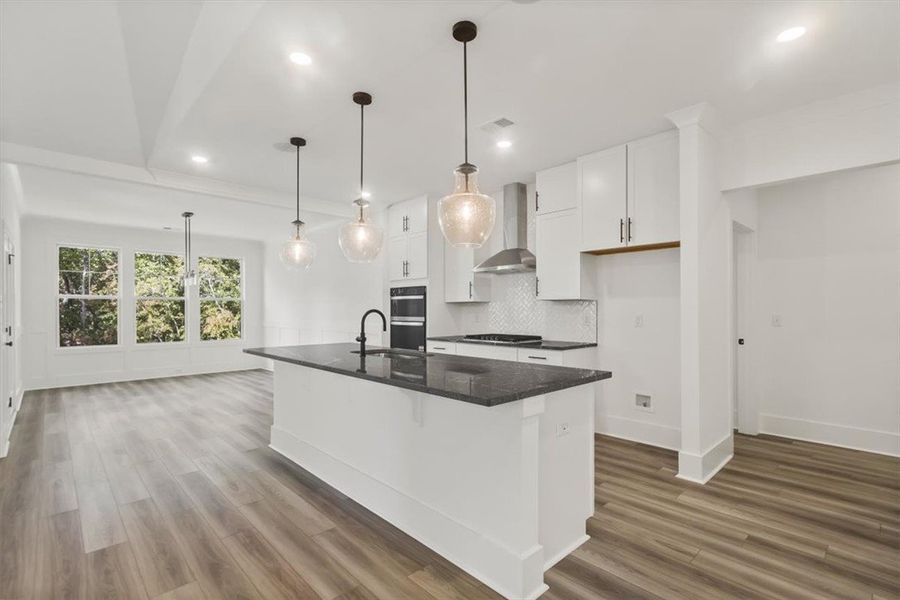 Gleaming quartz countertops and a spacious breakfa