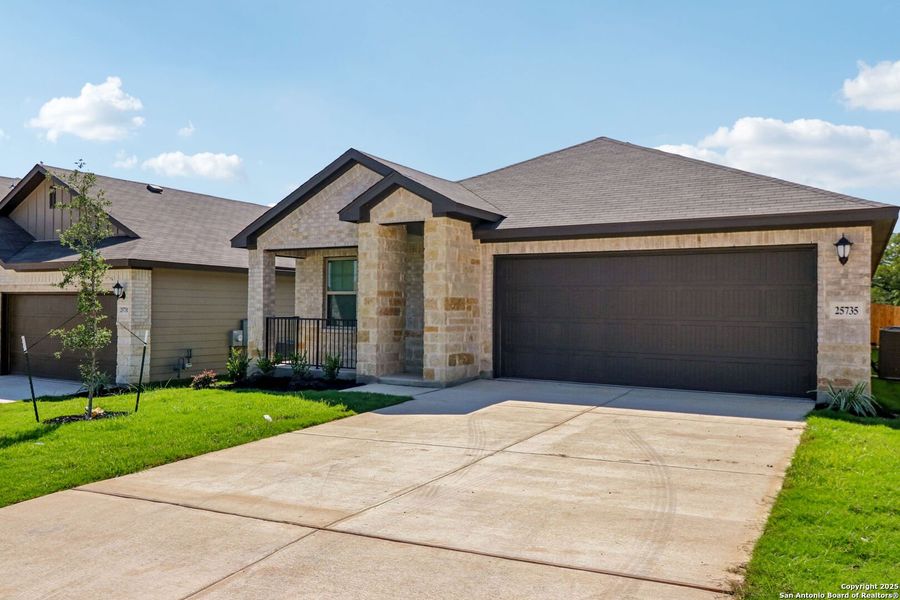 Front exterior of a new home in Scenic Crest - Premier Series, Boerne, TX, highlighting curb appeal (Image 26). Front exterior of a new home in Scenic Crest - Premier Series, Boerne, TX, highlighting curb appeal (Image 26).