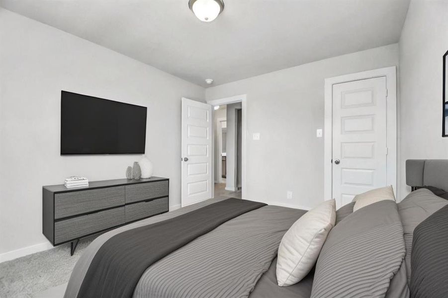 Generously sized secondary bedrooms featuring spacious closets, soft and inviting carpeting underfoot, large windows allowing plenty of natural light, and the added touch of privacy blinds for your personal retreat. *Virtually Staged*