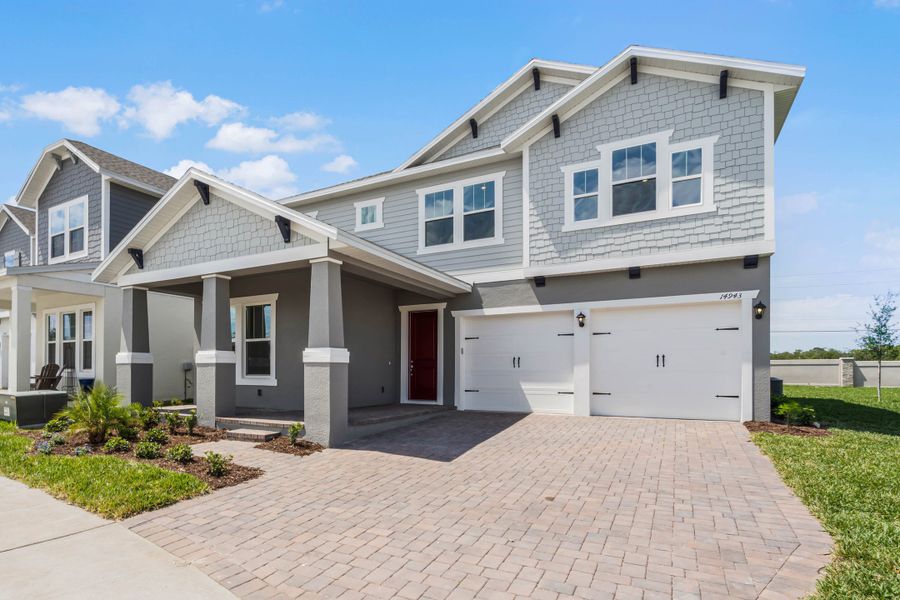 Representative exterior photo of a completed home built from the Frost by Rockwell Homes in Northlake at Ovation, Winter Garden, FL (Image 27). Representative exterior photo of a completed home built from the Frost by Rockwell Homes in Northlake at Ovation, Winter Garden, FL (Image 27).