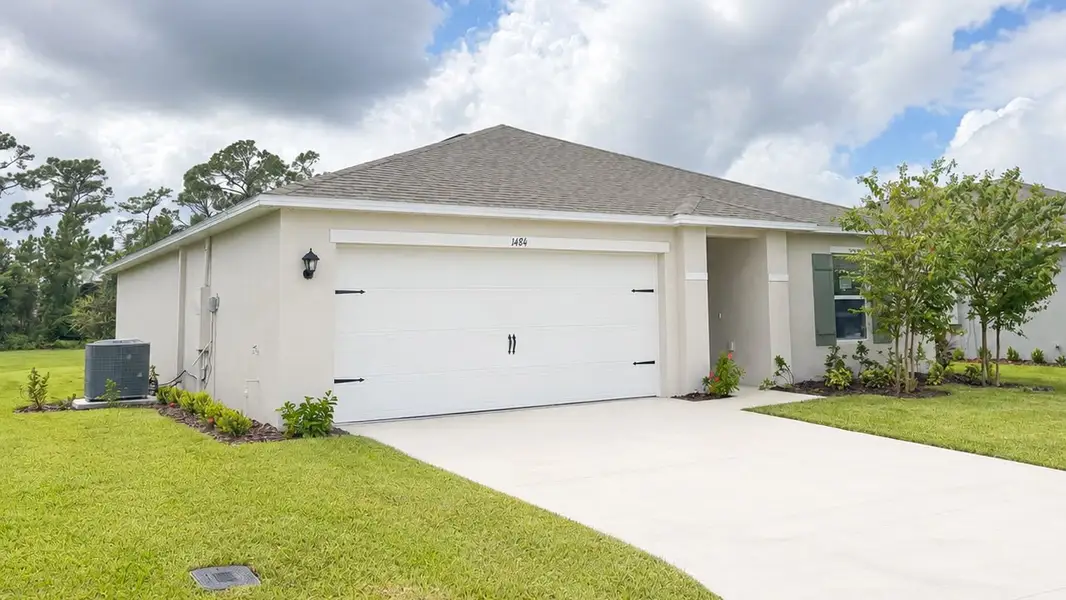 Front exterior of a new home in Fountain View, Ormond Beach, FL, highlighting curb appeal (Image 2).