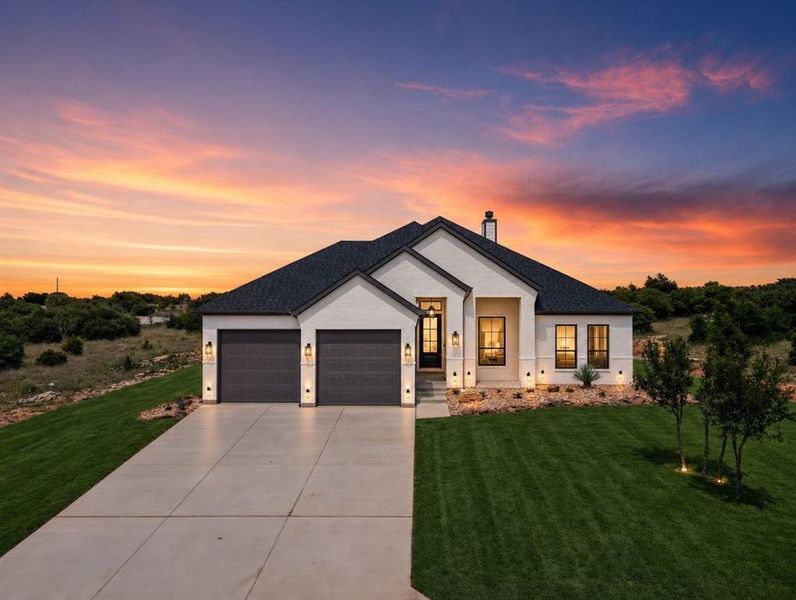 Front exterior of a new home in , Graford, TX, highlighting curb appeal (Image 2). Front exterior of a new home in , Graford, TX, highlighting curb appeal (Image 2).