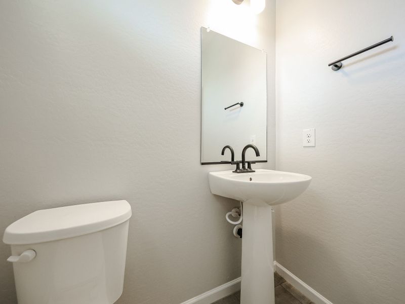 A bathroom with a sink and toilet. A bathroom with a sink and toilet.
