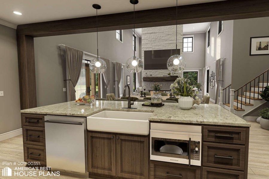 Kitchen featuring dark wood finish cabinets, stainless steel appliances, light stone counters, and a high ceiling