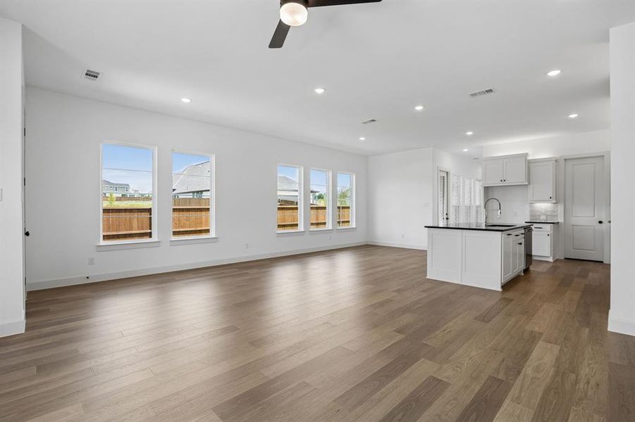 The family room effortlessly flows into the light and bright dining and kitchen areas.