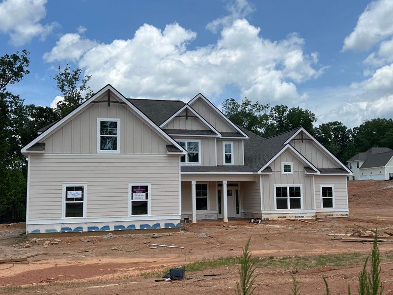 Front exterior of a new home in Highgate, Newnan, GA, highlighting curb appeal (Image 1).