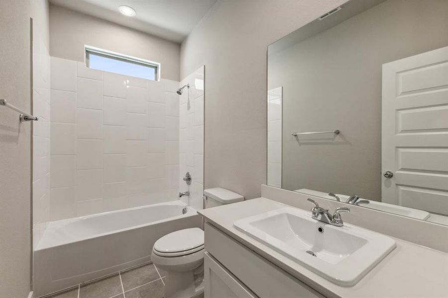 Bathroom in the Masters home plan by Trophy Signature Homes – REPRESENTATIVE PHOTO