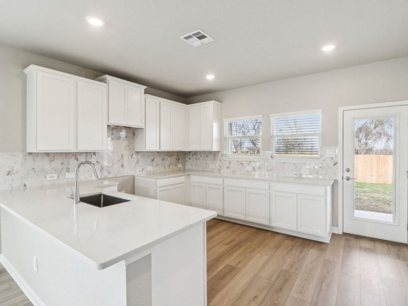 Kitchen in the Medina floorplan at a Meritage Homes community. Kitchen in the Medina floorplan at a Meritage Homes community.