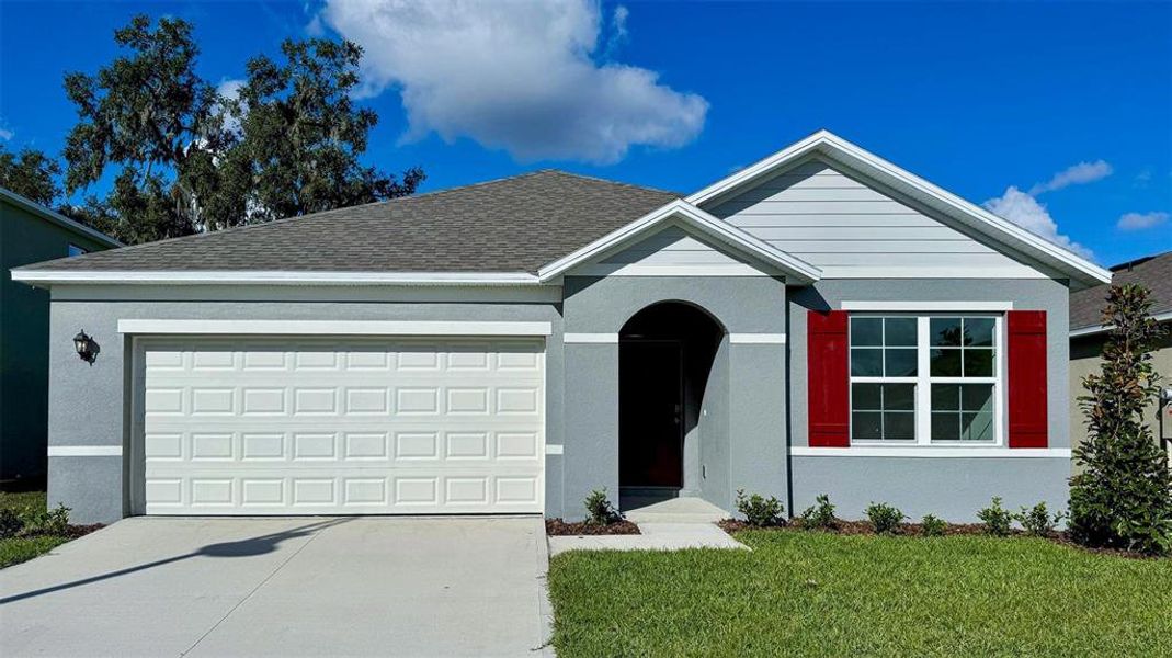 Front exterior of a new home in , St. Cloud, FL, highlighting curb appeal (Image 1).