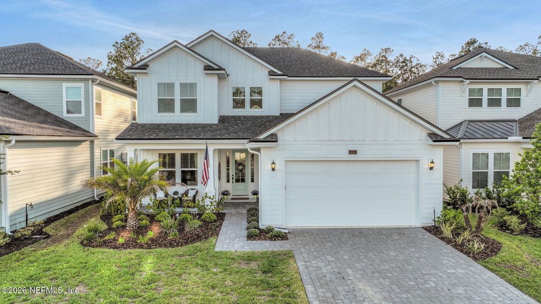 Front exterior of a new home in Settler's Landing at Nocatee, Ponte Vedra, FL, highlighting curb appeal (Image 30).