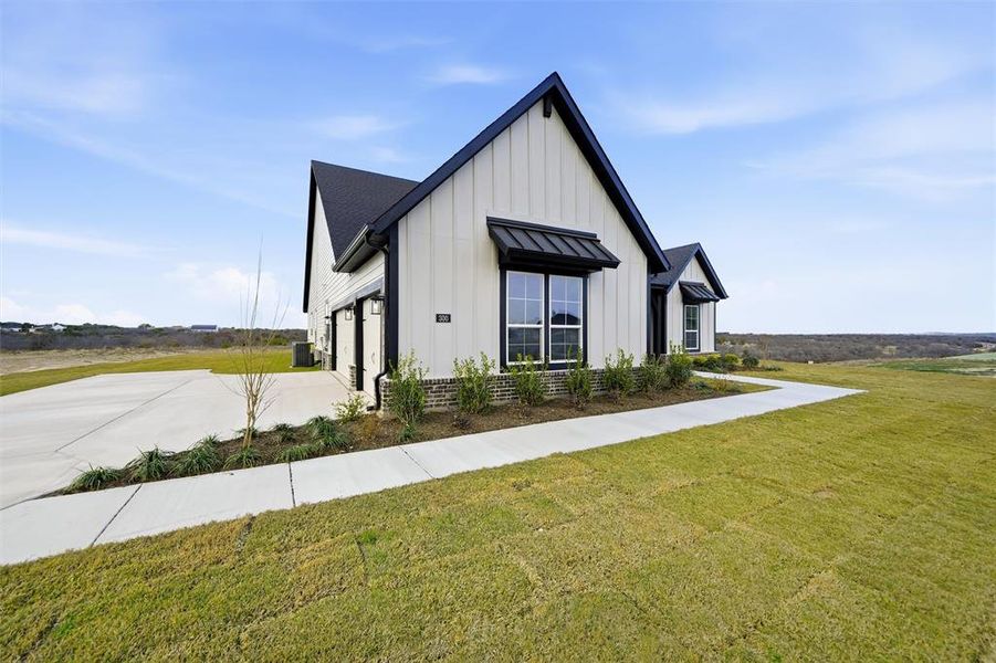 Front exterior of a new home in Eagle Ridge Estates, Weatherford, TX, highlighting curb appeal (Image 22).