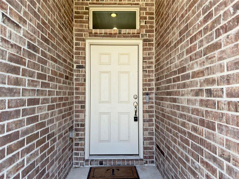 Entrance to property with brick siding Entrance to property with brick siding