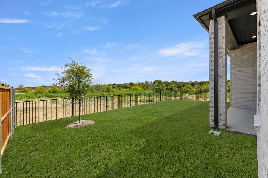 Exterior details and patio area of a home in Lily Creek at Sutton Fields, Aubrey (Image 21).