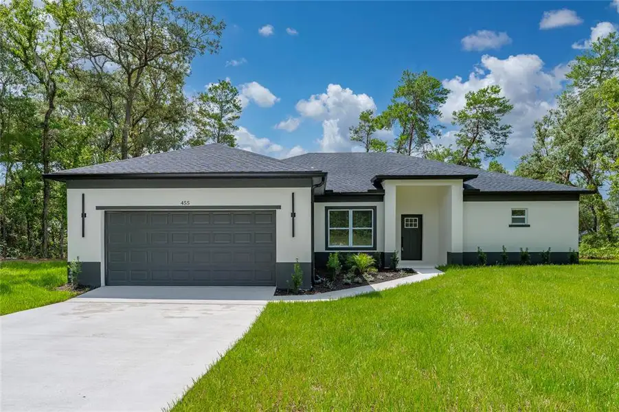 Front exterior of a new home in , Ocala, FL, highlighting curb appeal (Image 17). Front exterior of a new home in , Ocala, FL, highlighting curb appeal (Image 17).