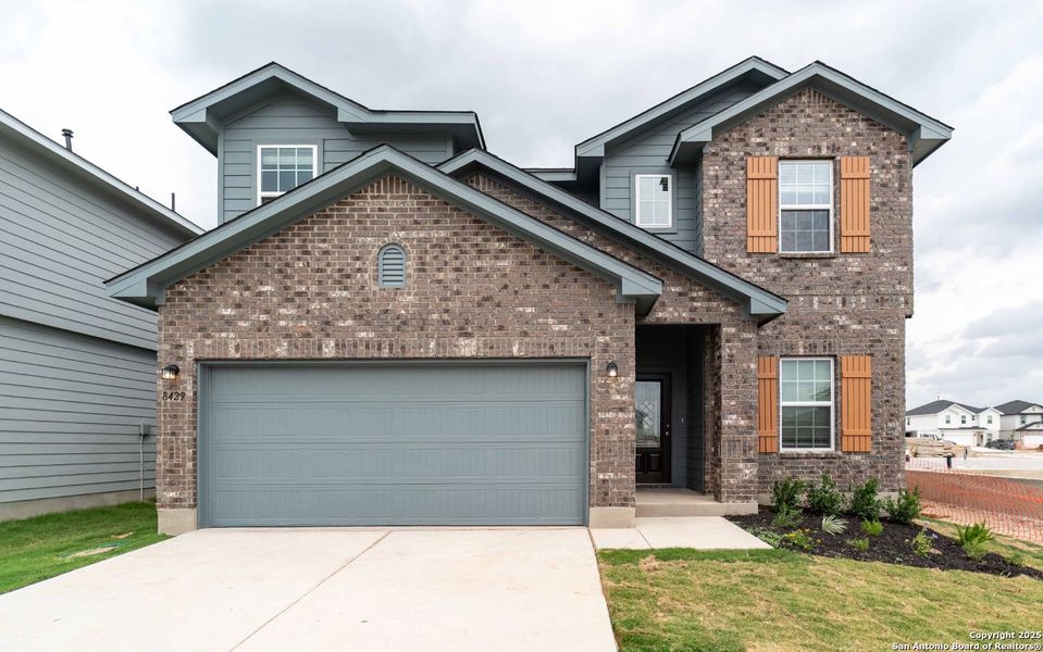 Front exterior of a new home in Red Hawk Landing, San Antonio, TX, highlighting curb appeal (Image 1).