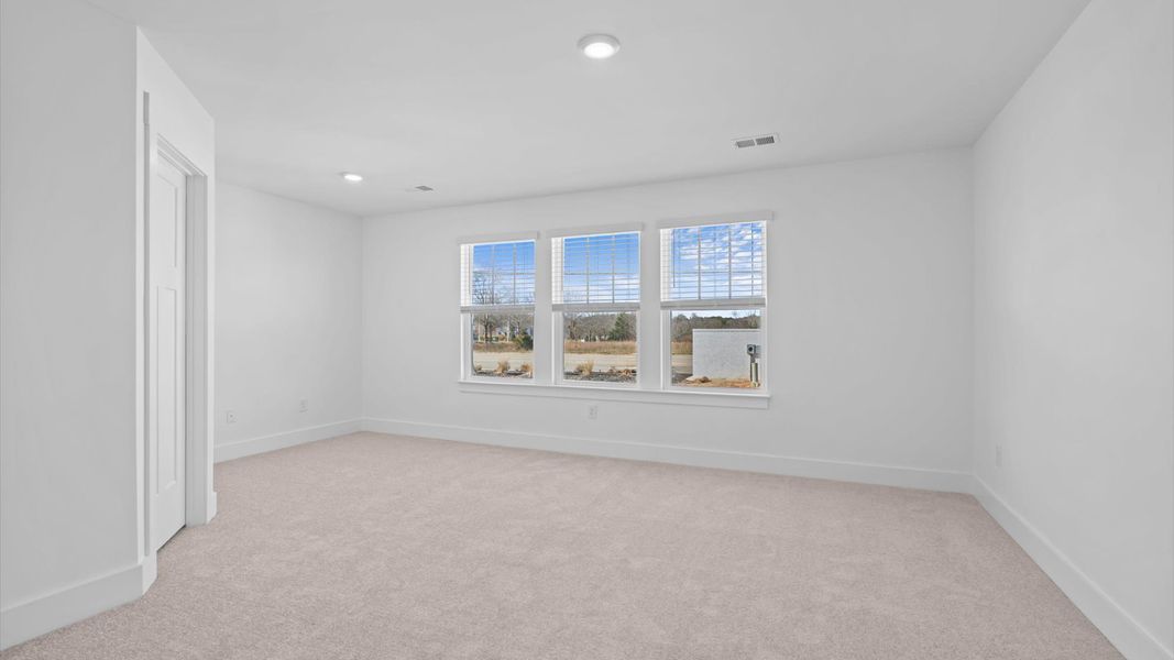 Memorable mornings begin in this tasteful and thoughtfully crafted primary suite at Silo Ridge townhome community