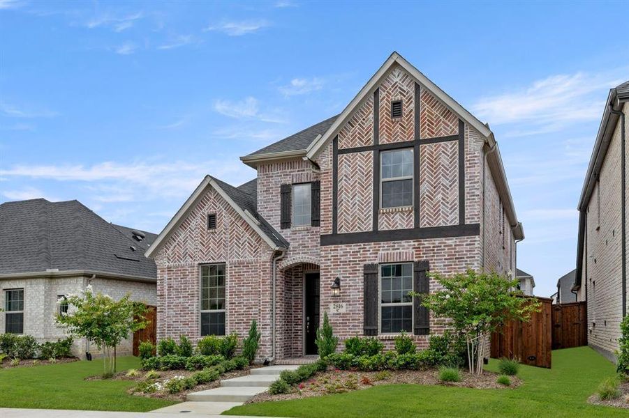 Front exterior of a new home in Cambridge Crossing, Celina, TX, highlighting curb appeal (Image 1).
