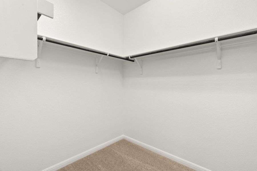 Walk-in closet in Primary Bedroom - Representative Photo Walk-in closet in Primary Bedroom - Representative Photo