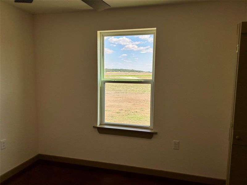 Spare room featuring healthy amount of natural light