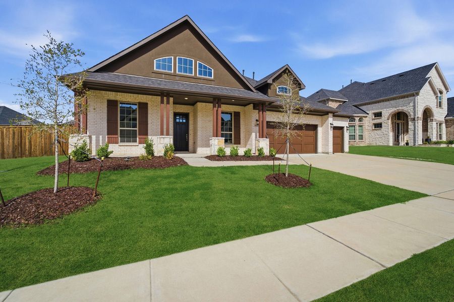 Front exterior of a new home in Sonoma Verde, Heath, TX, highlighting curb appeal (Image 22).